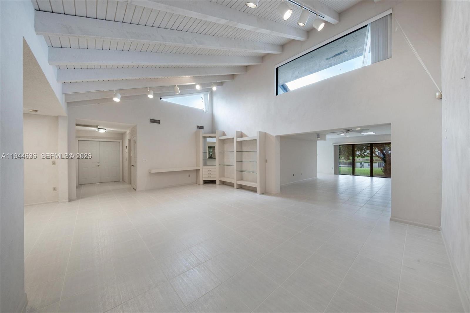 21877 Arriba Real Boca Raton, FL 33433 - Photo 18 of 40 an empty room with a empty space and windows