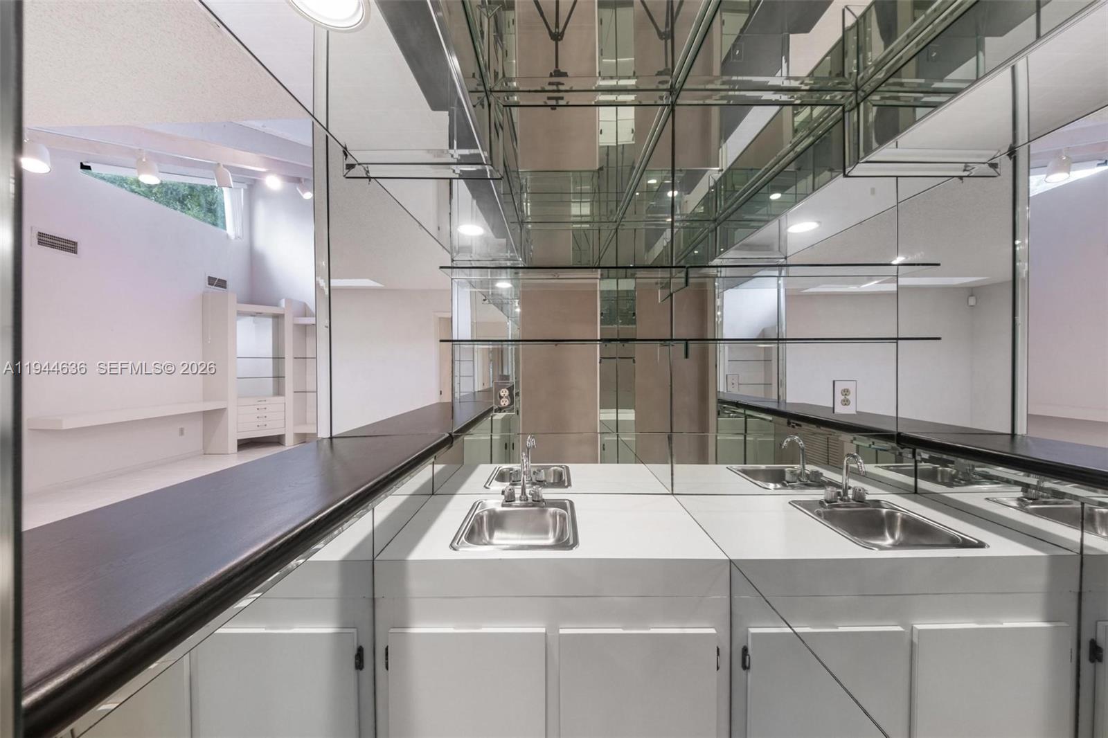 21877 Arriba Real Boca Raton, FL 33433 - Photo 25 of 40 a utility room with a sink and wooden floor