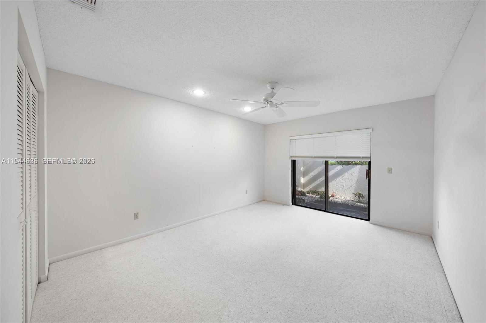 21877 Arriba Real Boca Raton, FL 33433 - Photo 33 of 40 a view of an empty room with a window