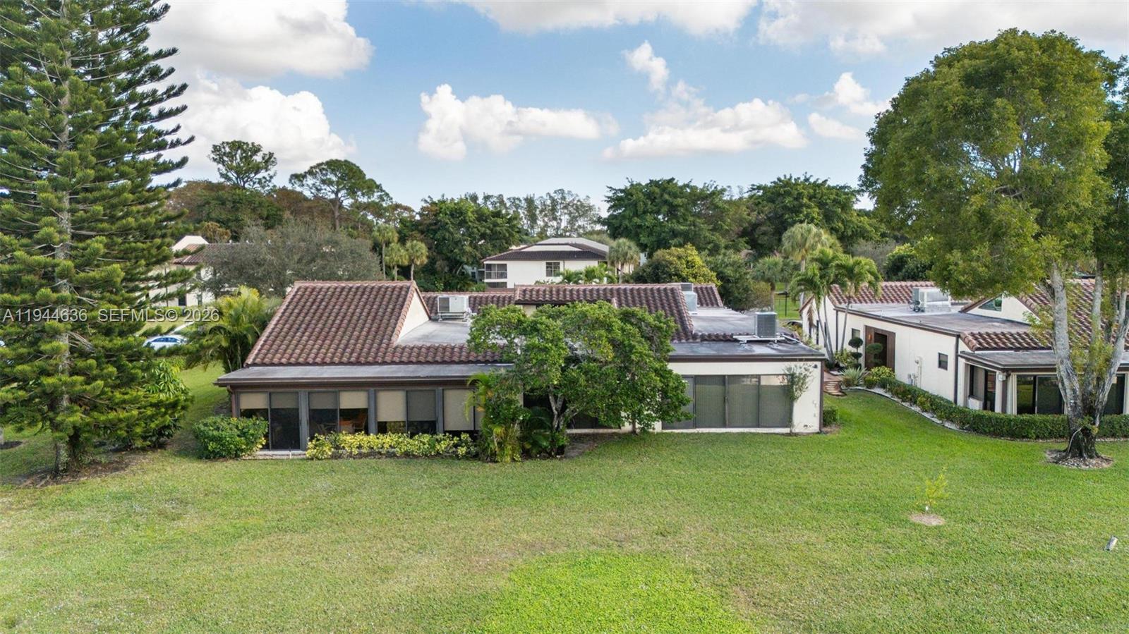 21877 Arriba Real Boca Raton, FL 33433 - Photo 39 of 40 a front view of a house with a garden