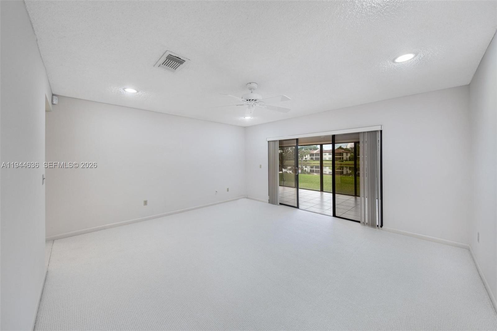 21877 Arriba Real Boca Raton, FL 33433 - Photo 9 of 40 a view of an empty room with glass door