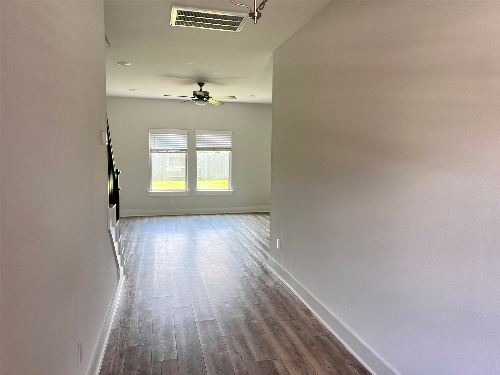 10638 Whitejacket Conroe, TX 77385 - Photo 17 of 25 an empty room with wooden floor and windows
