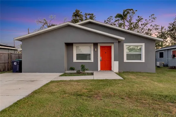 a house with yard in front of it