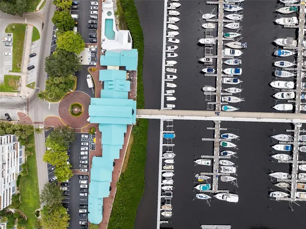 an aerial view of a residential apartment building with a street