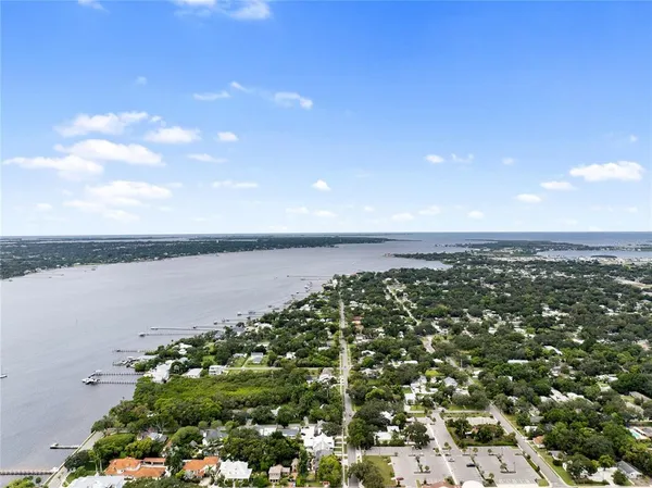 a view of a large body of water with a building in the background