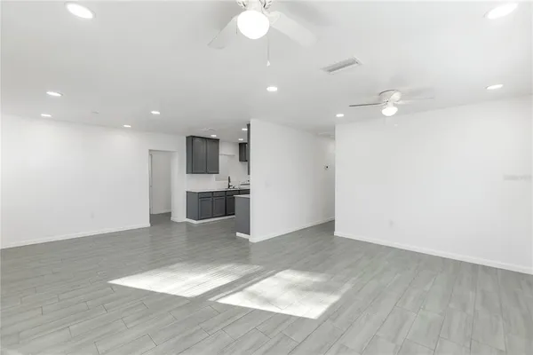 a view of a kitchen with a sink and a stove top oven