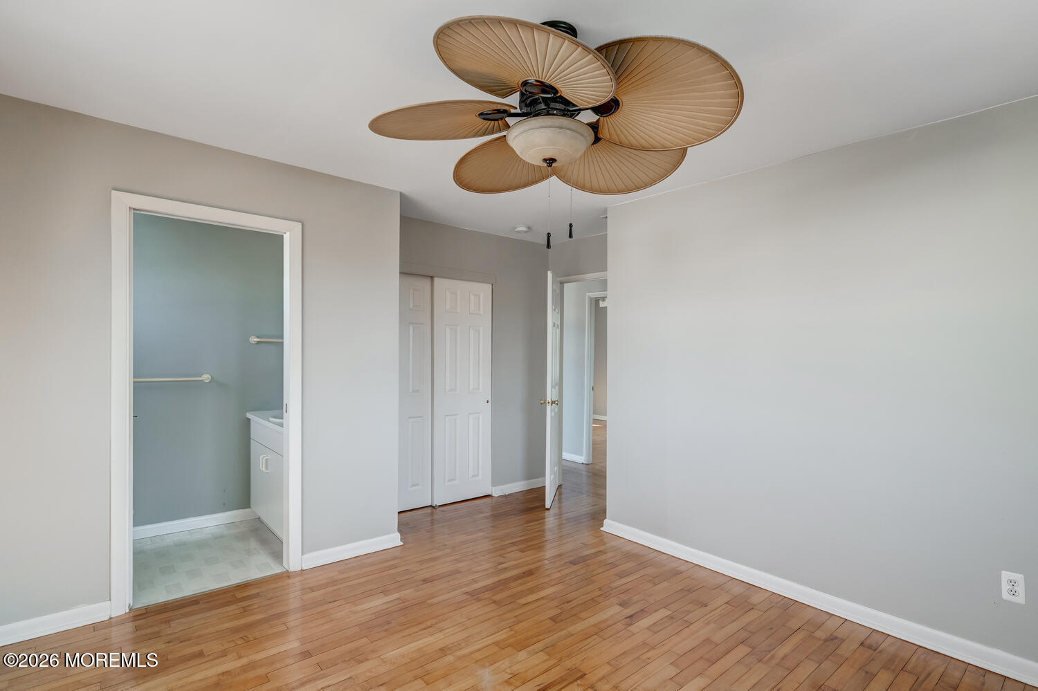 2402 R Central Avenue Barnegat Light, NJ 08006 - Photo 12 of 27 a view of a room with wooden floor and ceiling fan