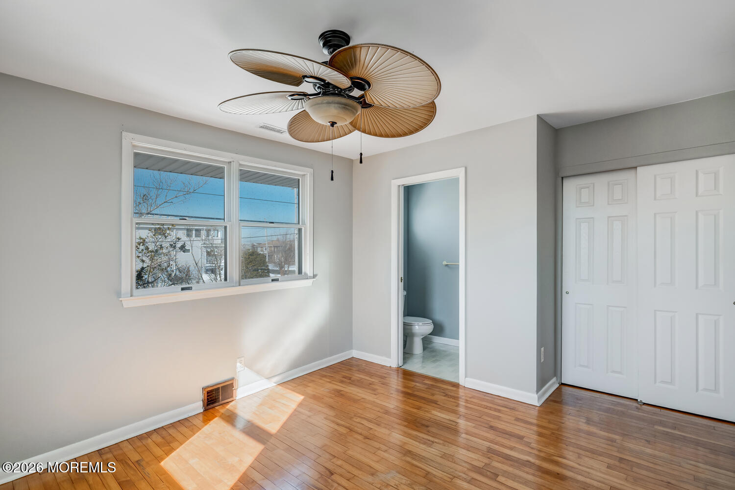 2402 R Central Avenue Barnegat Light, NJ 08006 - Photo 14 of 27 a very nice looking room with wooden floor and ceiling fan
