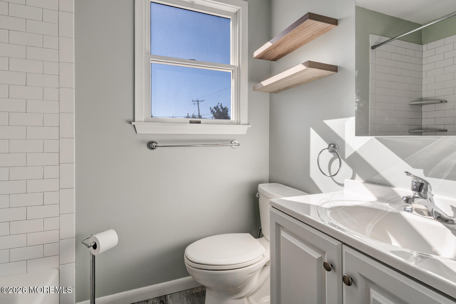 2402 R Central Avenue Barnegat Light, NJ 08006 - Photo 15 of 27 a bathroom with a sink and a toilet