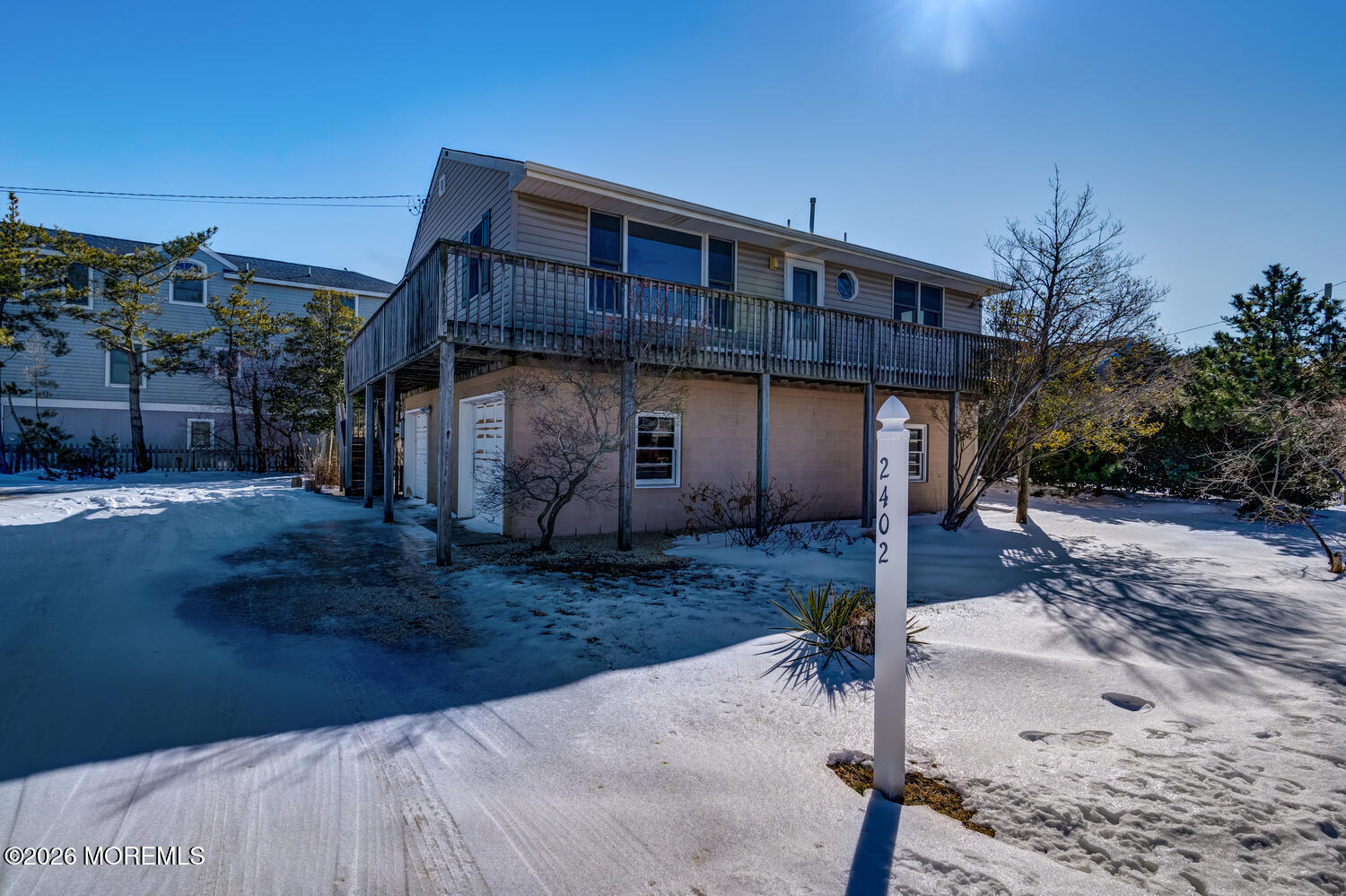 2402 R Central Avenue Barnegat Light, NJ 08006 - Photo 20 of 27 a front view of a house with garden