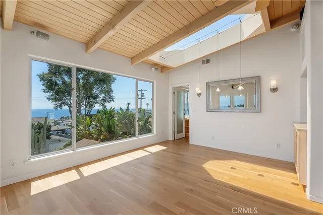 a view of a kitchen with wooden floor and a kitchen