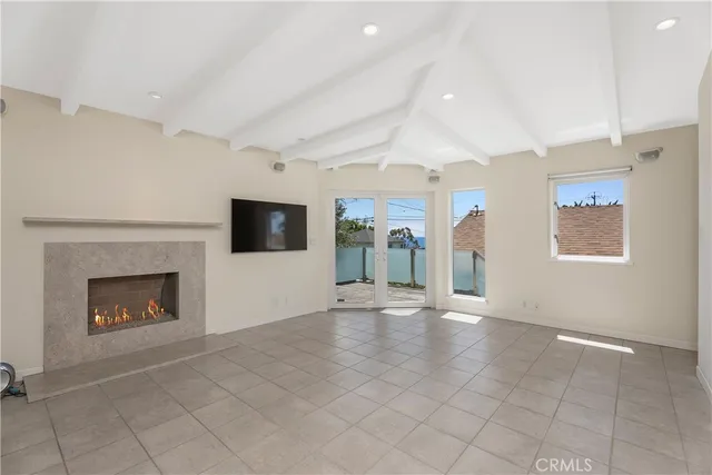 a view of an empty room with windows