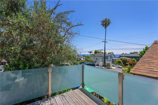 a view of a terrace with wooden floor and fence