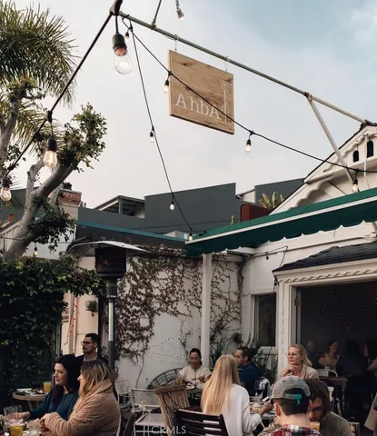 a view of a tree in front of a house