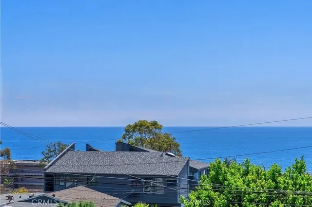a view of a room with wooden floor and windows