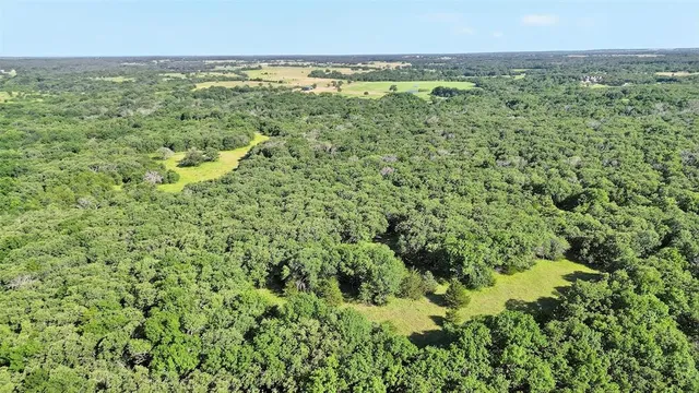 a view of a field with an outdoor space