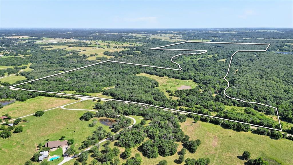 0 Fm-2383 Gainesville, TX 76240 - Photo 3 of 23 an aerial view of a residential houses with outdoor space and trees