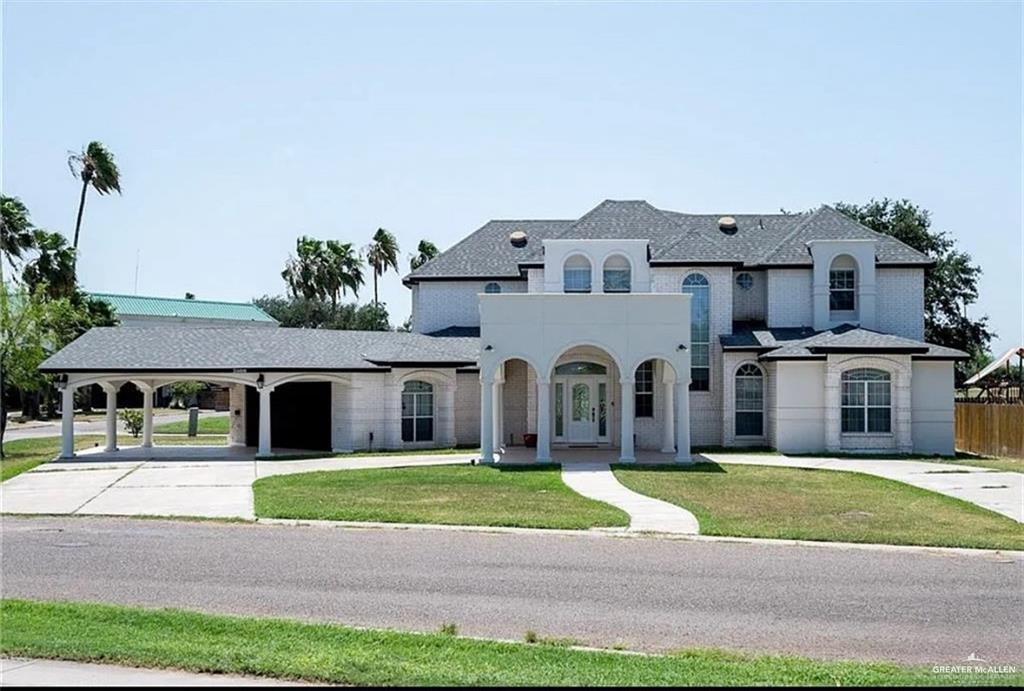 a front view of a house with a yard