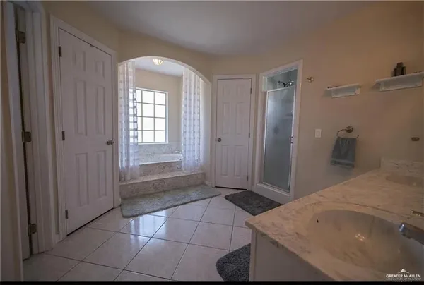 a view of a bathroom with a sink and a vanity