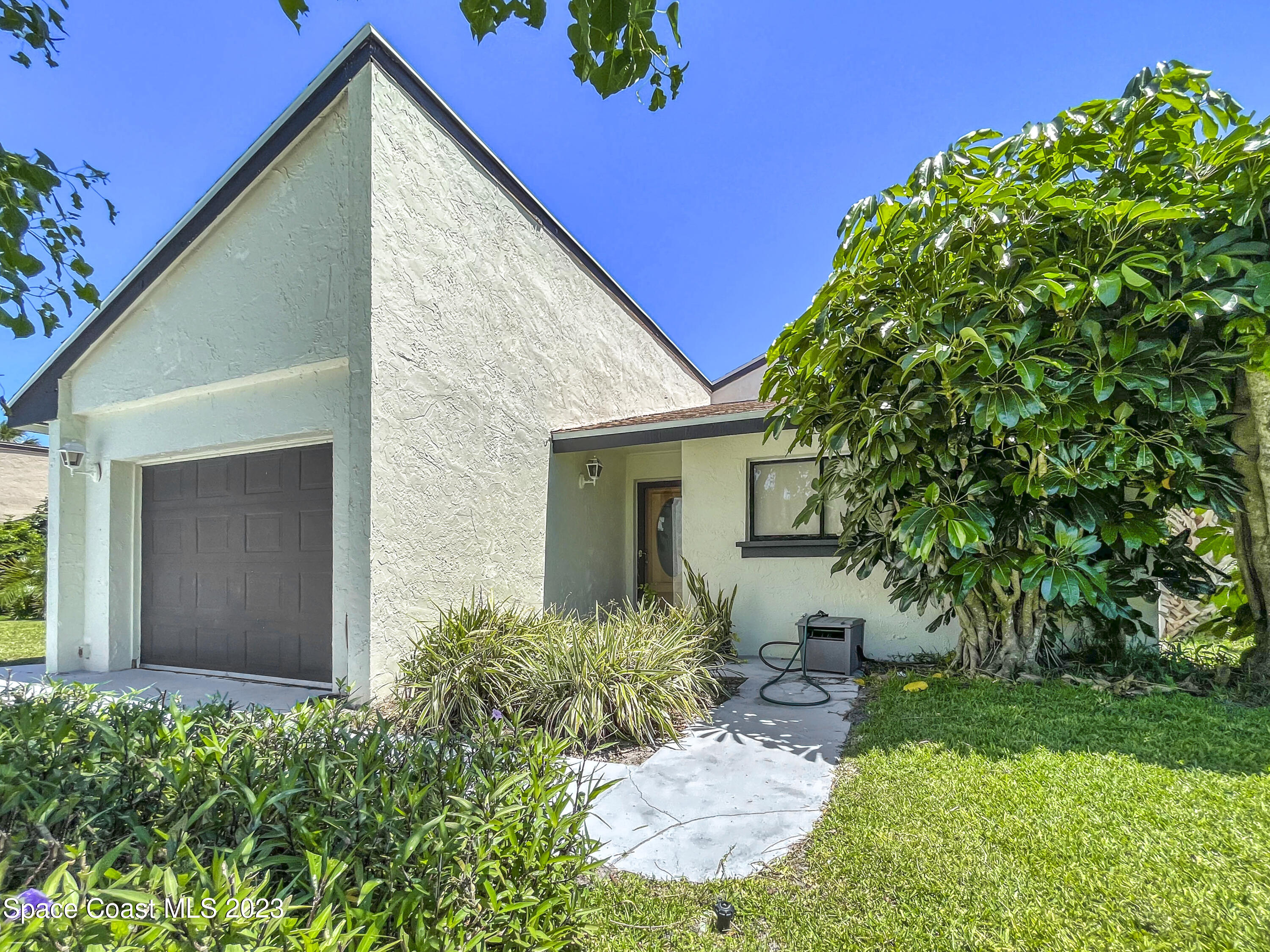 295 Bayhead Drive Melbourne, FL 32940 - Photo 3 of 19 a view of a house with a yard
