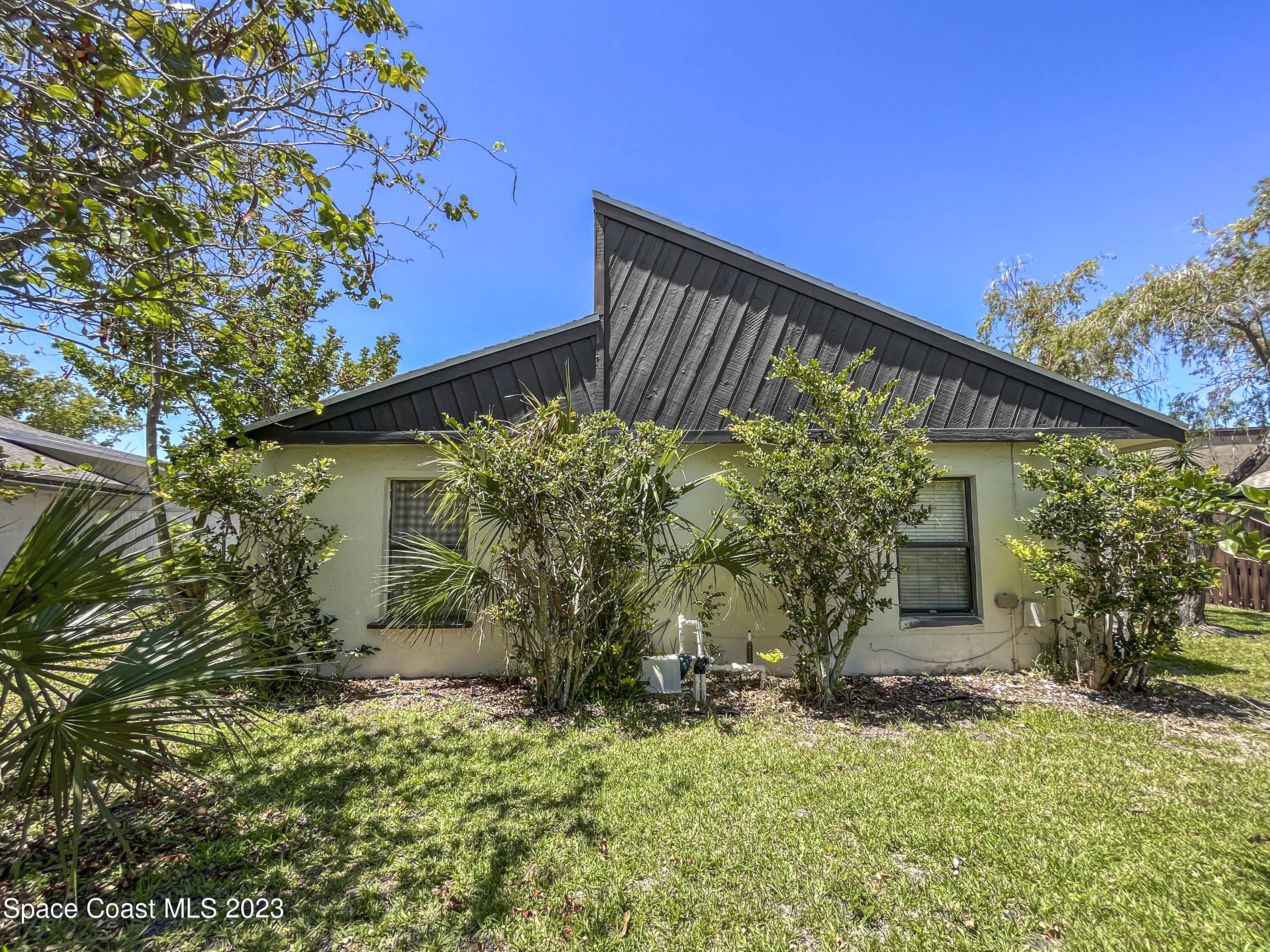 295 Bayhead Drive Melbourne, FL 32940 - Photo 4 of 19 front view of a house with a yard