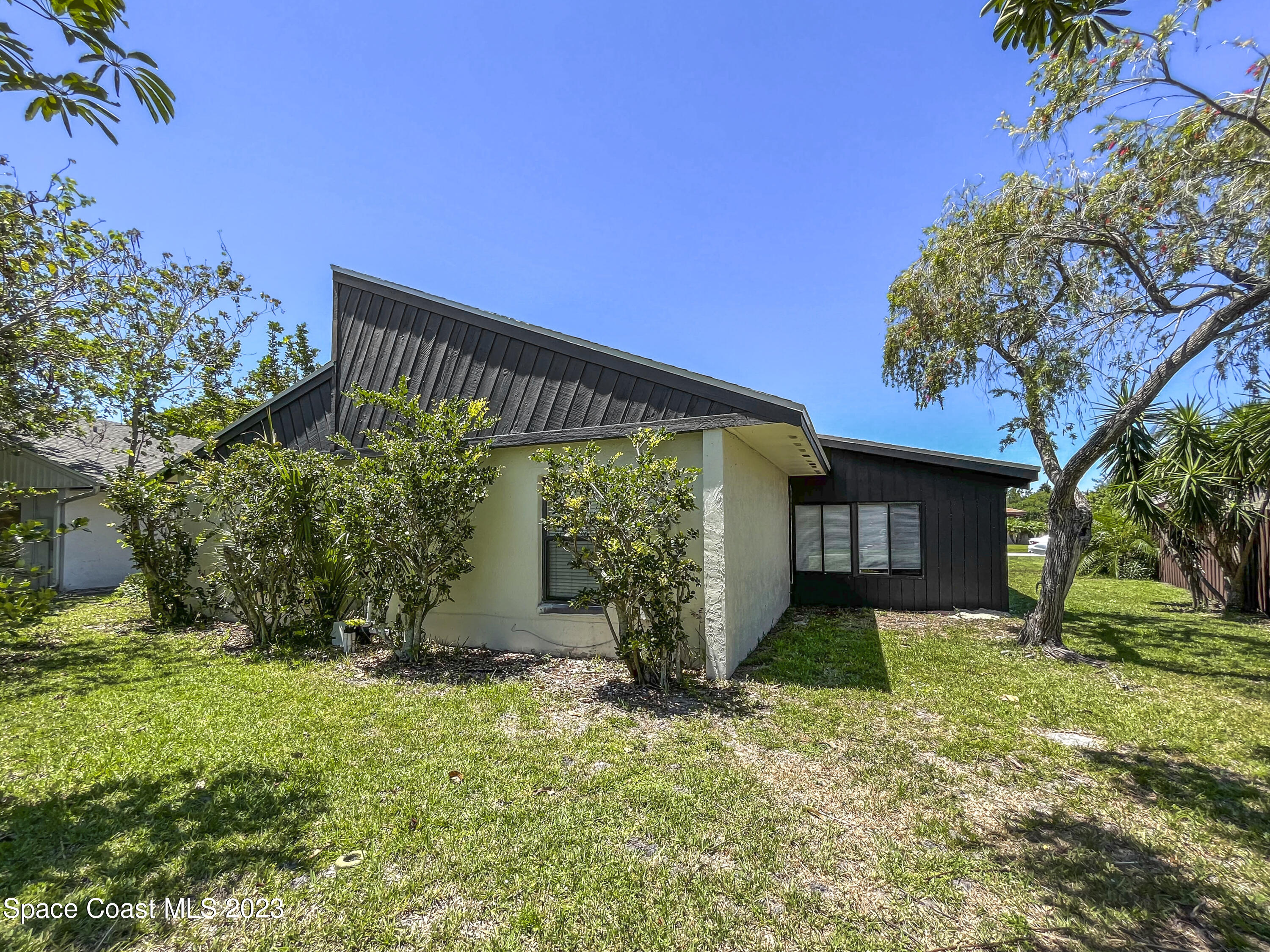 295 Bayhead Drive Melbourne, FL 32940 - Photo 5 of 19 a front view of a house with garden