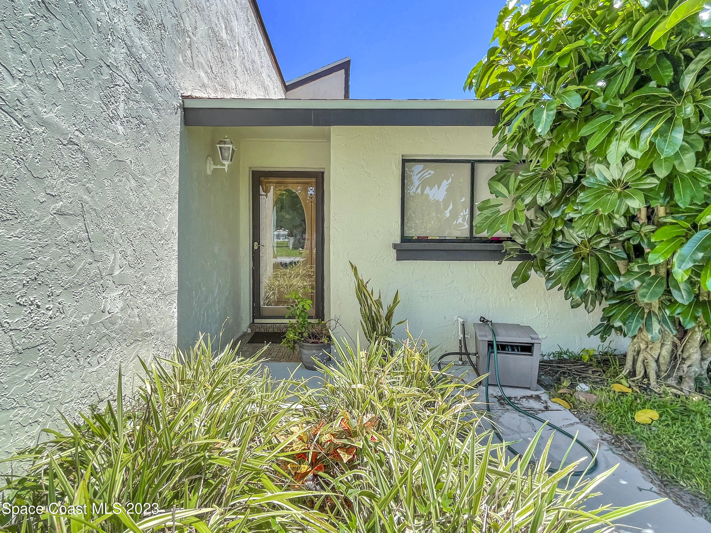 295 Bayhead Drive Melbourne, FL 32940 - Photo 6 of 19 a front view of a house with a yard