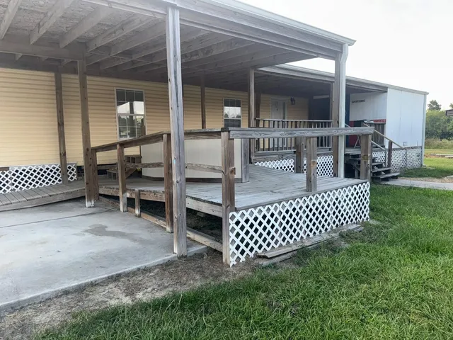 a view of a patio with a table and chairs