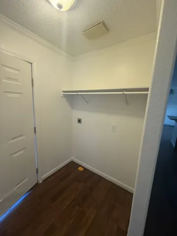 an empty room with wooden floor