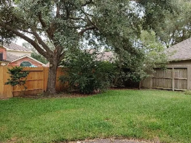 a view of backyard with green space
