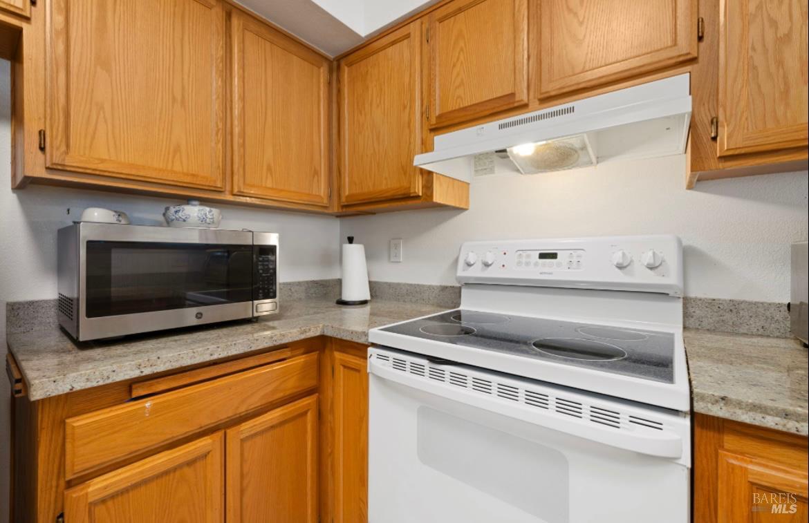 605 Laurel Grove Circle Santa Rosa, CA 95407 - Photo 28 of 29 a kitchen with granite countertop cabinets and steel stainless steel appliances
