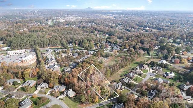 an aerial view of houses with yard
