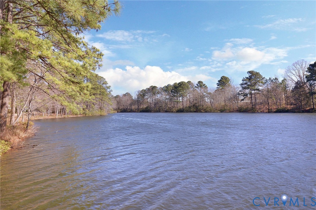 4015 Cold Spring Road Williamsburg, VA 23188 - Photo 49 of 57 Expansive lake frontage with a wooded shoreline fe