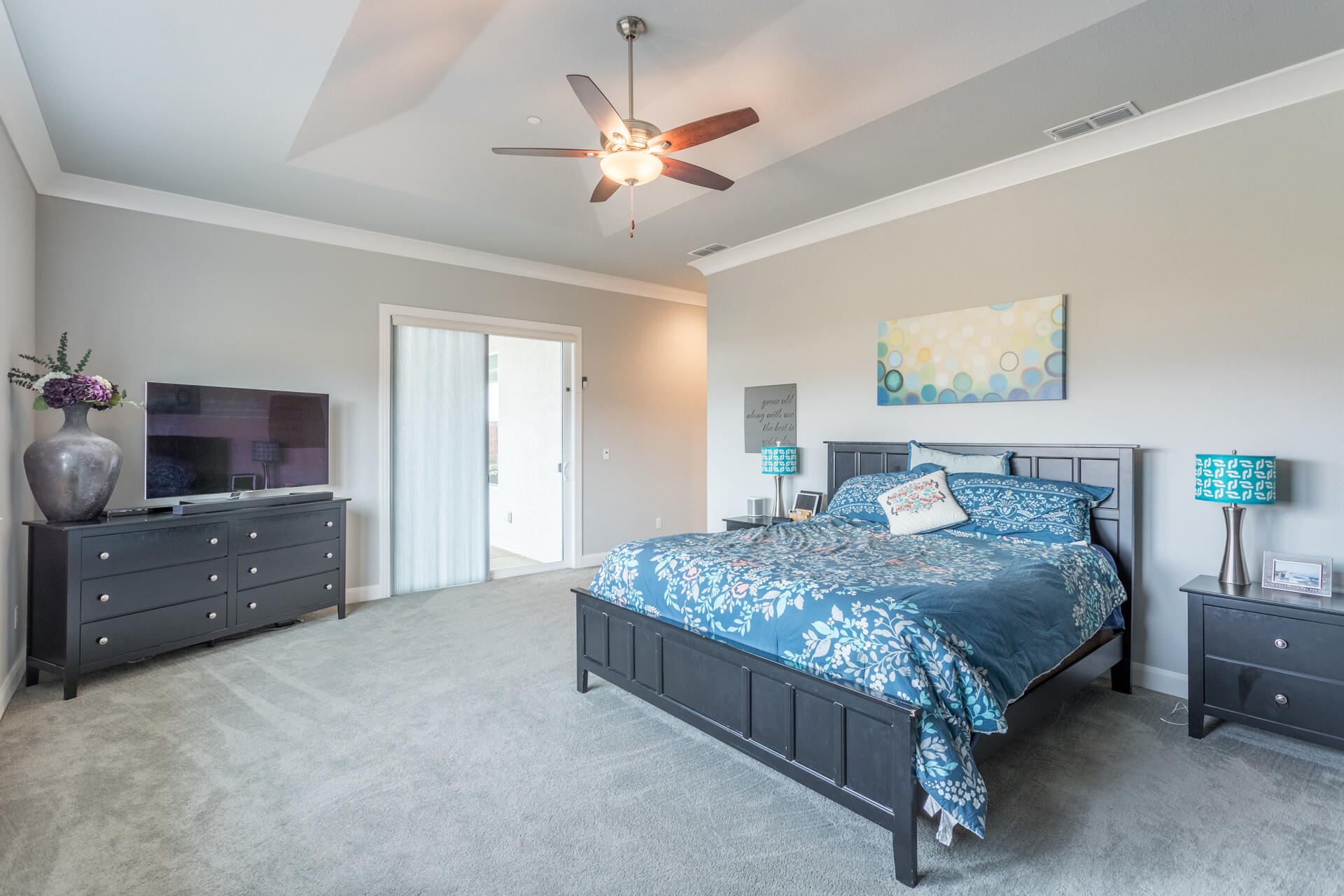 4720 Lower Springs Road Redding, CA 96001 - Photo 11 of 21 a bedroom with a bed and a dresser in it