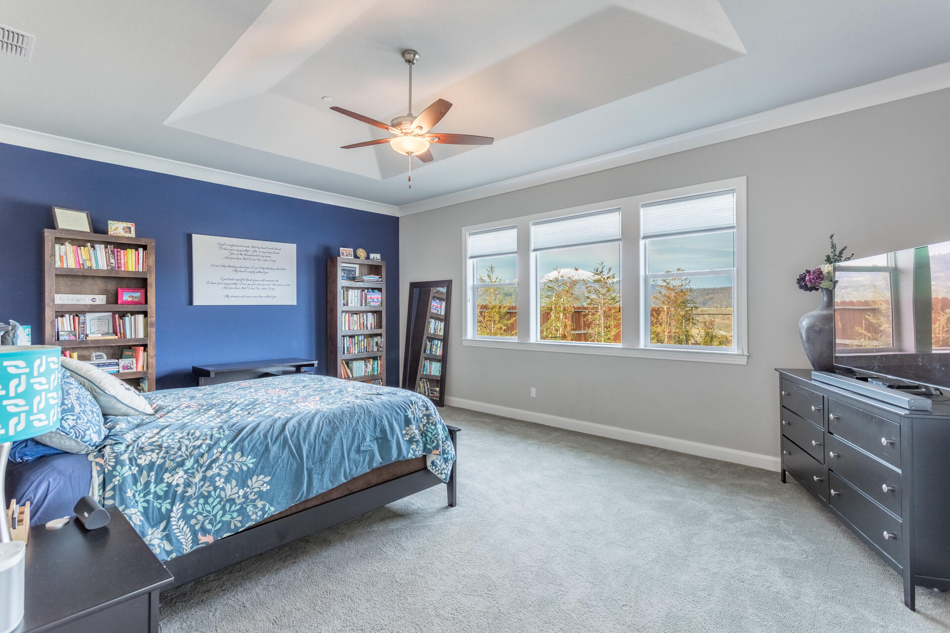 4720 Lower Springs Road Redding, CA 96001 - Photo 12 of 21 a bedroom with a bed and dresser with chair