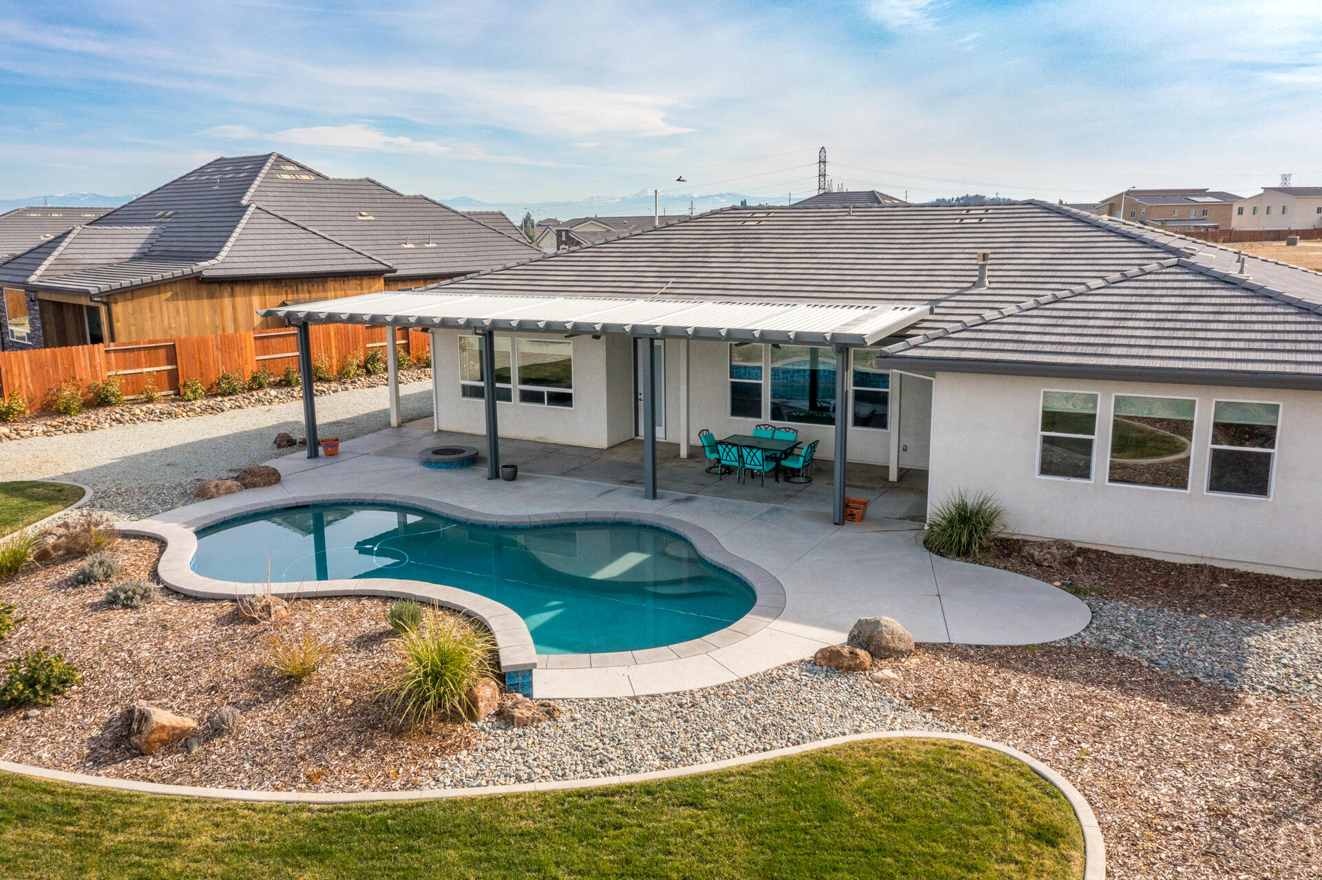 4720 Lower Springs Road Redding, CA 96001 - Photo 18 of 21 a view of a house with swimming pool and sitting area