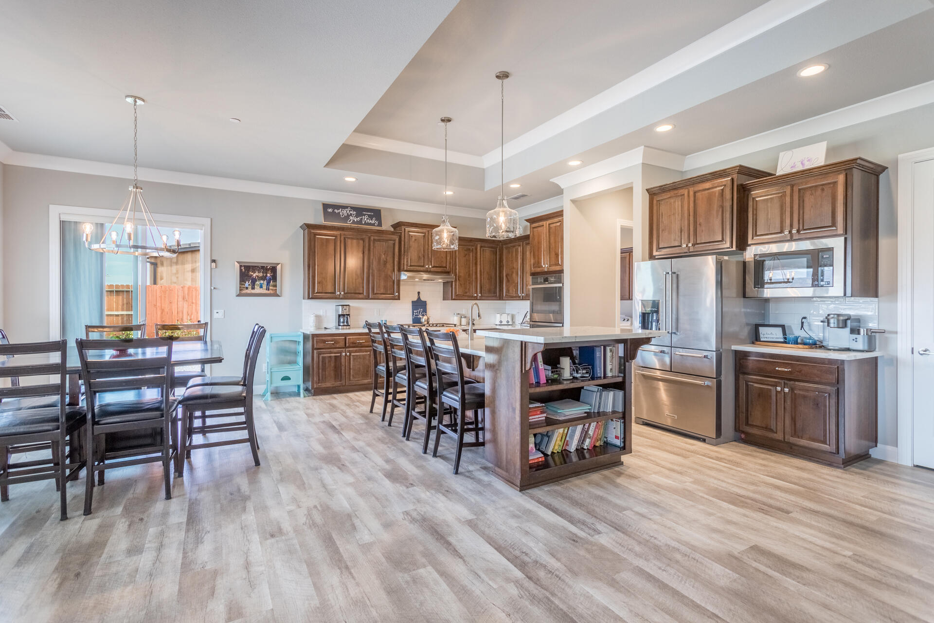4720 Lower Springs Road Redding, CA 96001 - Photo 2 of 21 a kitchen with stainless steel appliances a dining table chairs stove and cabinets