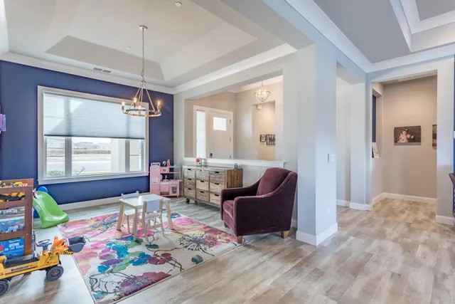 a bedroom with a bed and a dresser in it