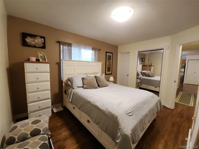 a bedroom with a bed and a cabinets