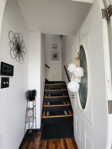 a view of entryway with wooden floor