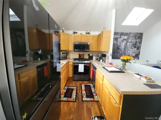 a kitchen with a sink stove and refrigerator