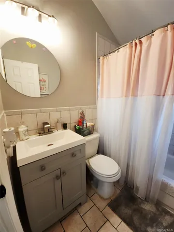 a view of bathroom with a sink and a mirror