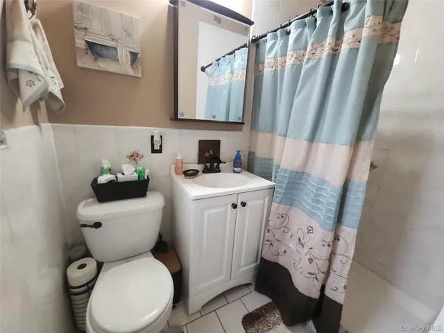 a bathroom with a toilet sink and tub