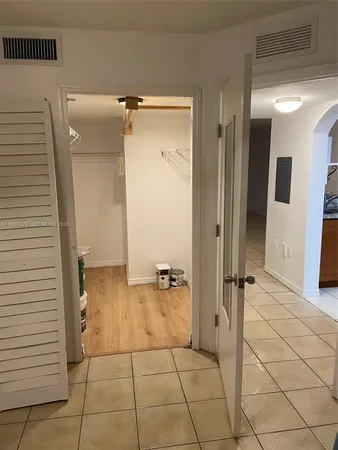 a bathroom with a shower and a sink