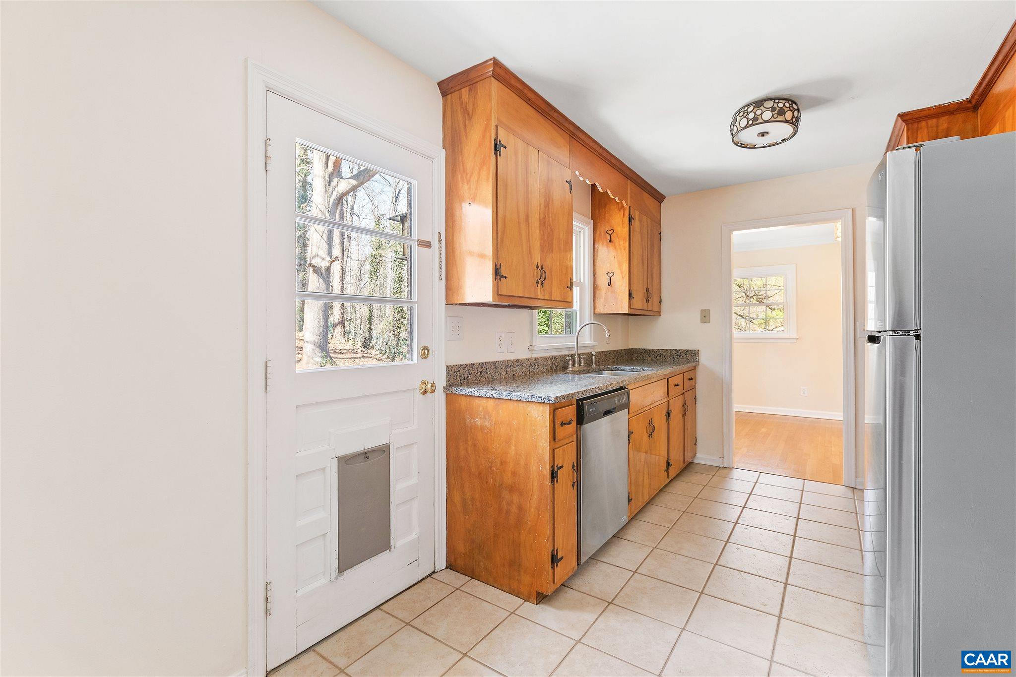 1600 Ricky Road Charlottesville, VA 22901 - Photo 11 of 34 a kitchen with stainless steel appliances granite countertop a stove a sink and a refrigerator