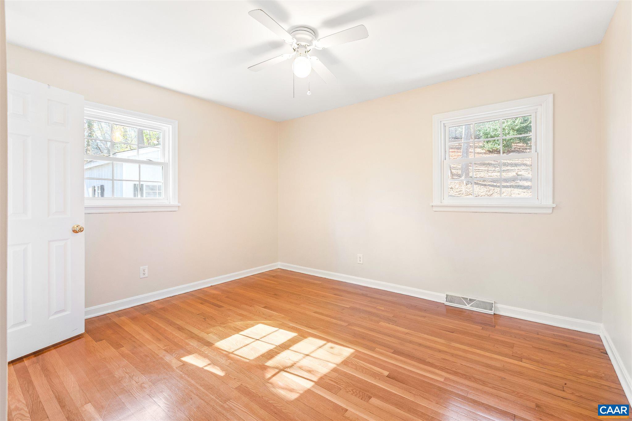 1600 Ricky Road Charlottesville, VA 22901 - Photo 13 of 34 a view of an empty room with wooden floor and a window