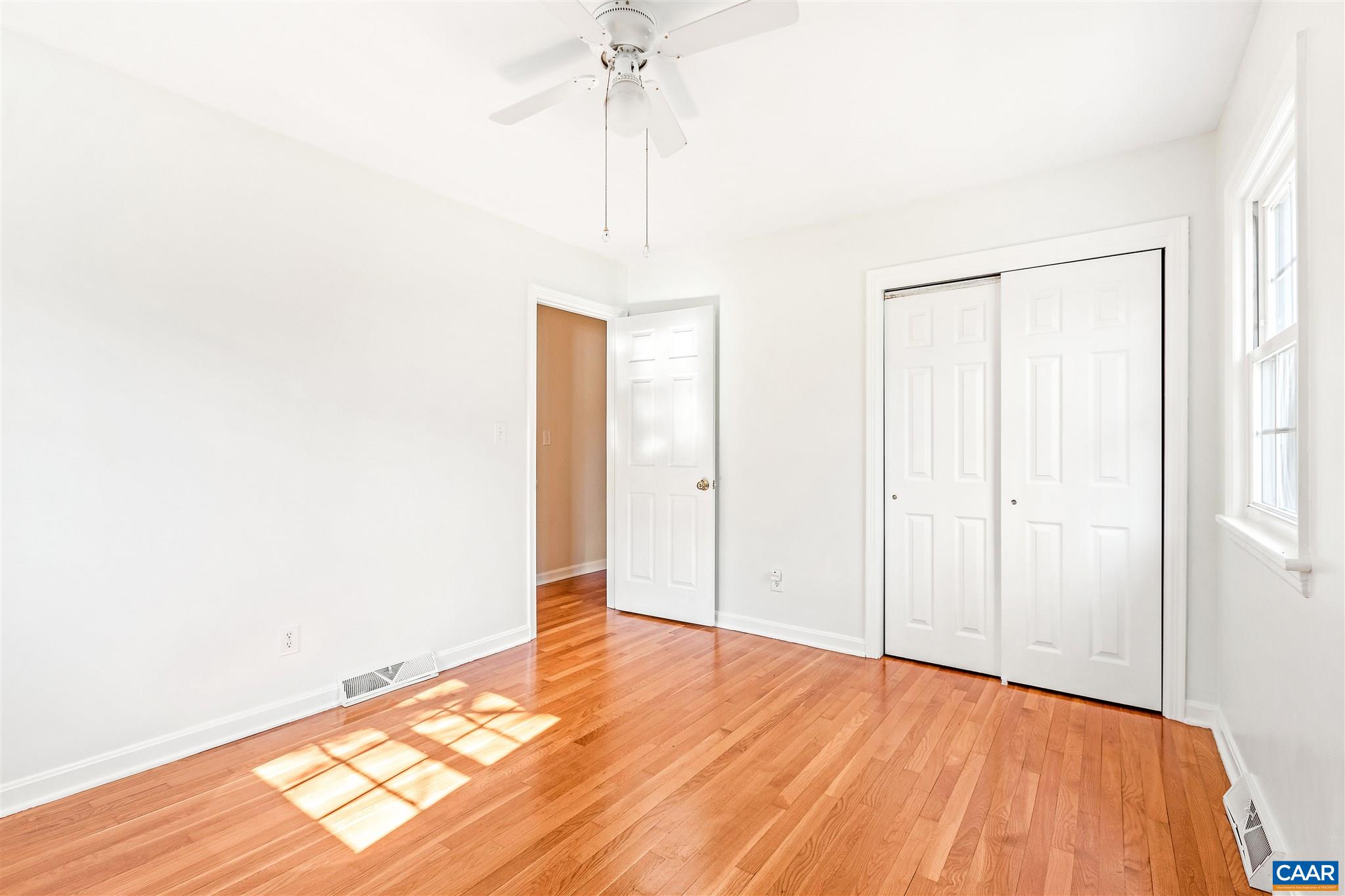 1600 Ricky Road Charlottesville, VA 22901 - Photo 17 of 34 a view of empty room with wooden floor and fan