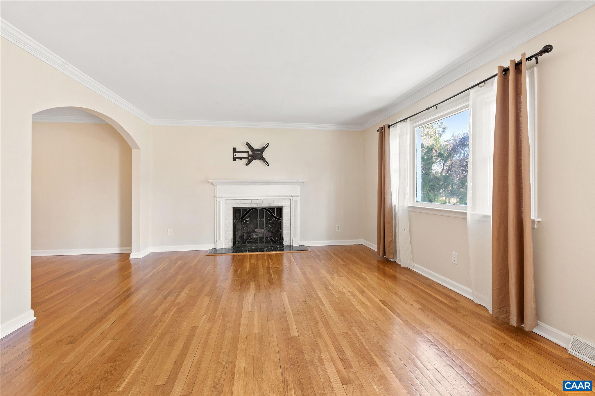 1600 Ricky Road Charlottesville, VA 22901 - Photo 2 of 34 a view of empty room with wooden floor and fireplace