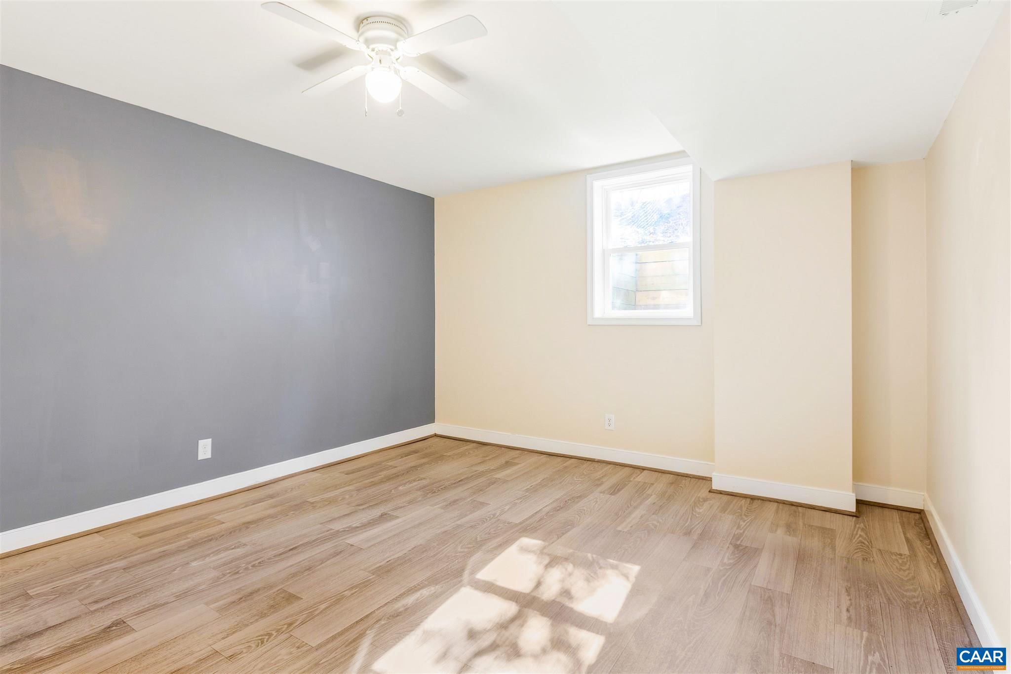 1600 Ricky Road Charlottesville, VA 22901 - Photo 25 of 34 an empty room with wooden floor and windows