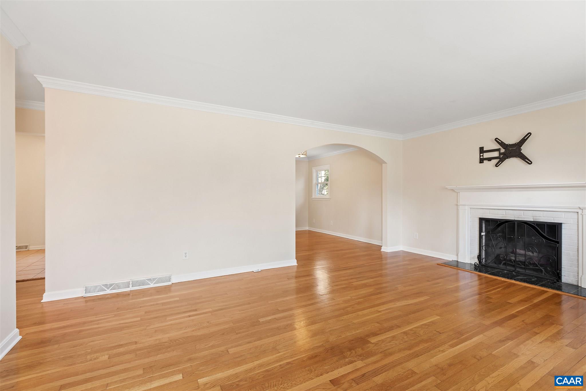 1600 Ricky Road Charlottesville, VA 22901 - Photo 3 of 34 a view of empty room with wooden floor and fireplace